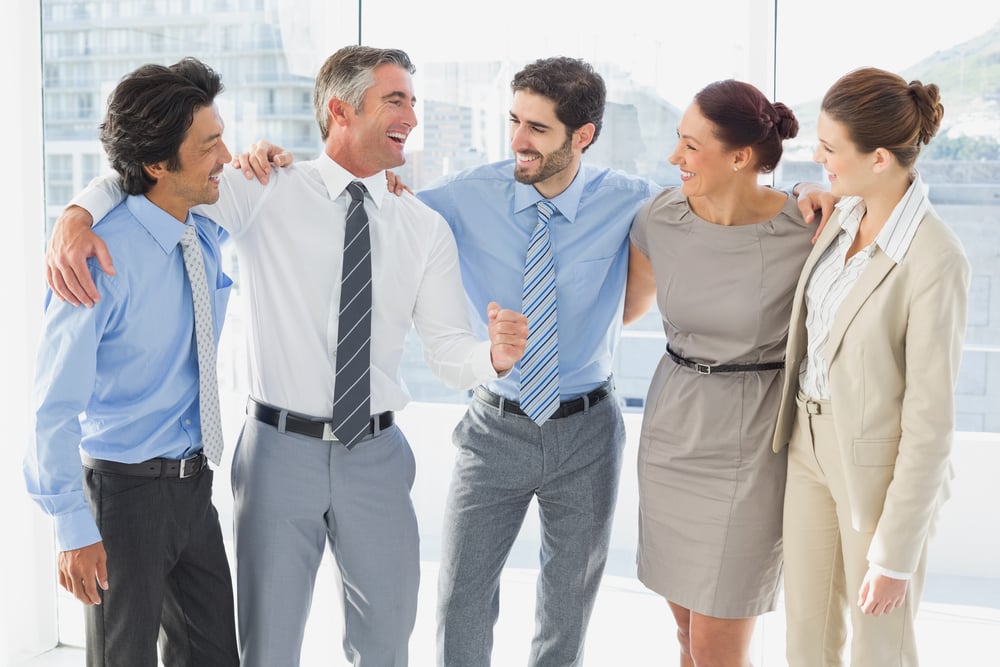 Employees smiling and having fun at work